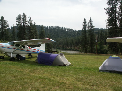 Grass Landing Strip with planes parked on side