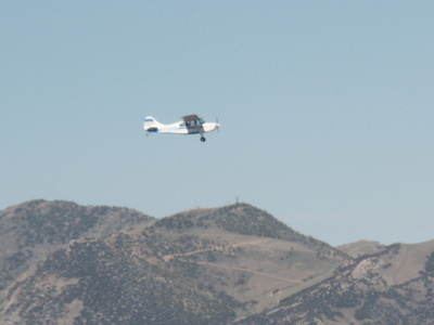 Grass Landing Strip with planes parked on side